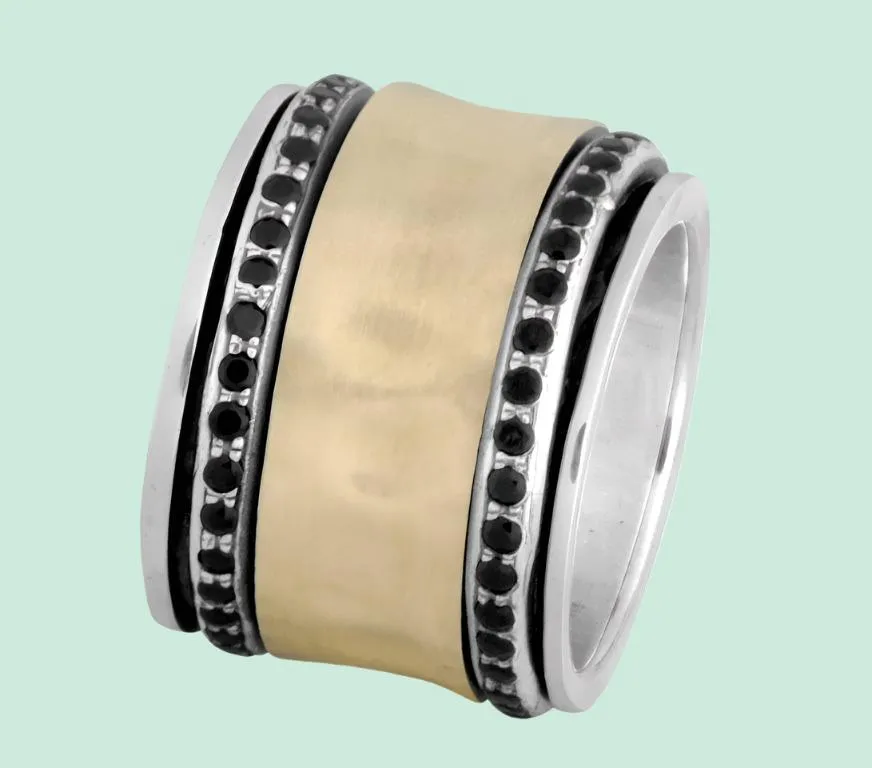 Elegant spinner ring silver and gold set with garnets